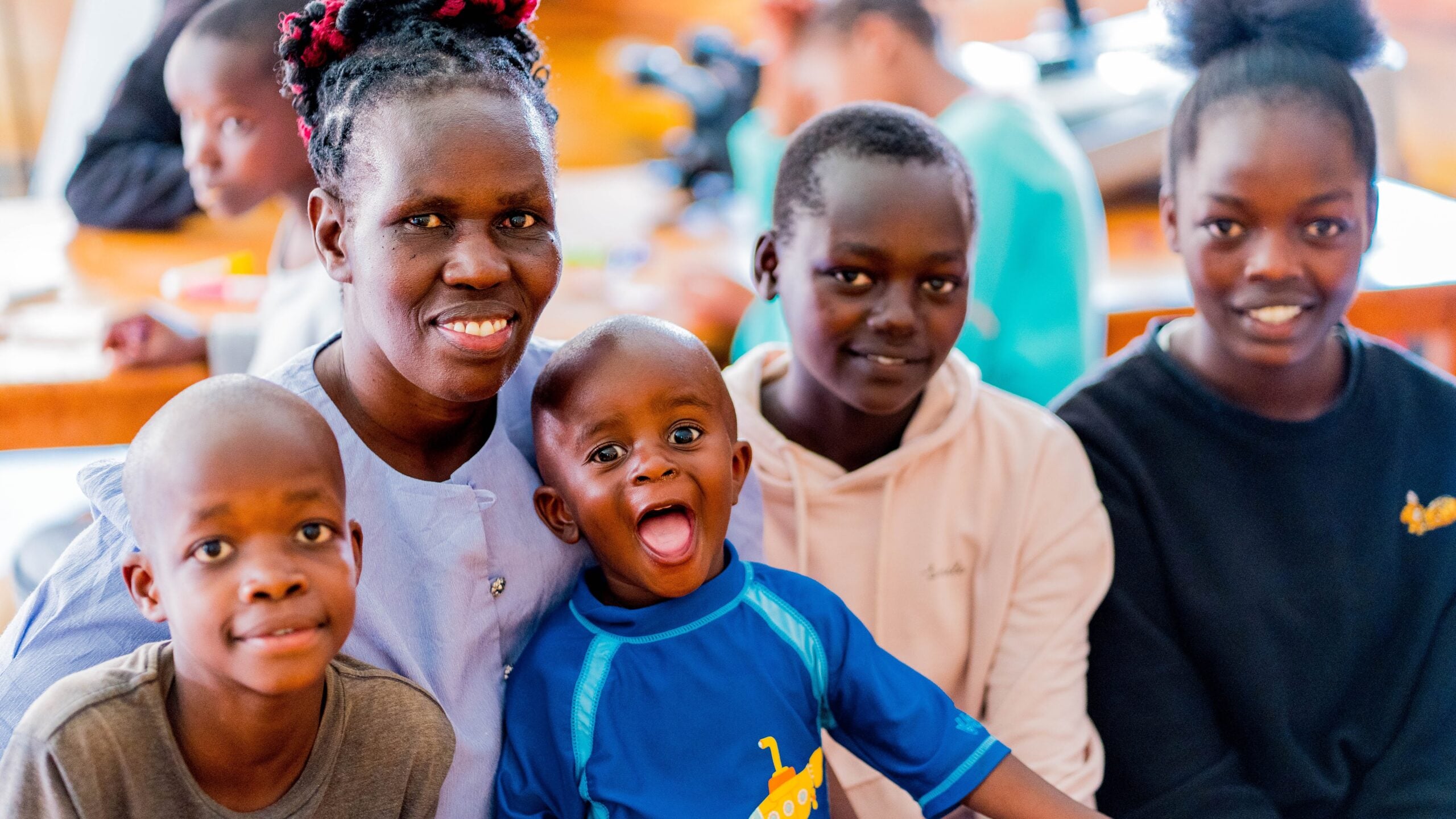 An auntie with children at Children of Hope